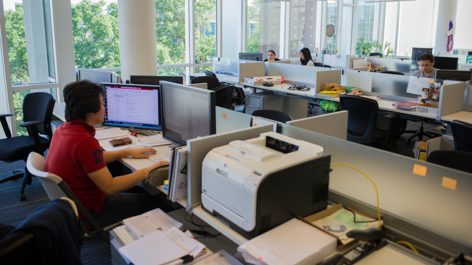 Several individuals in a computer lab