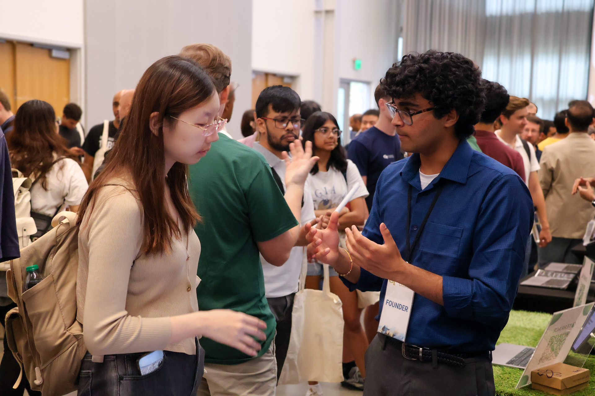 Students discussing their startups