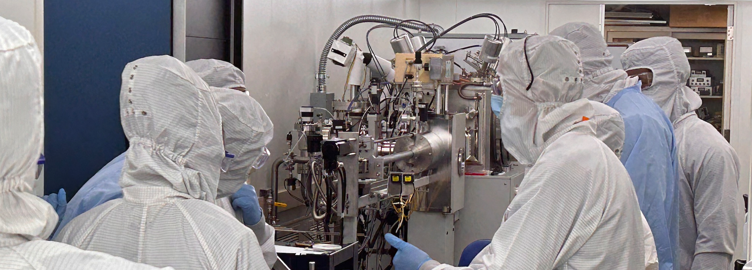 researchers in full lab gear 