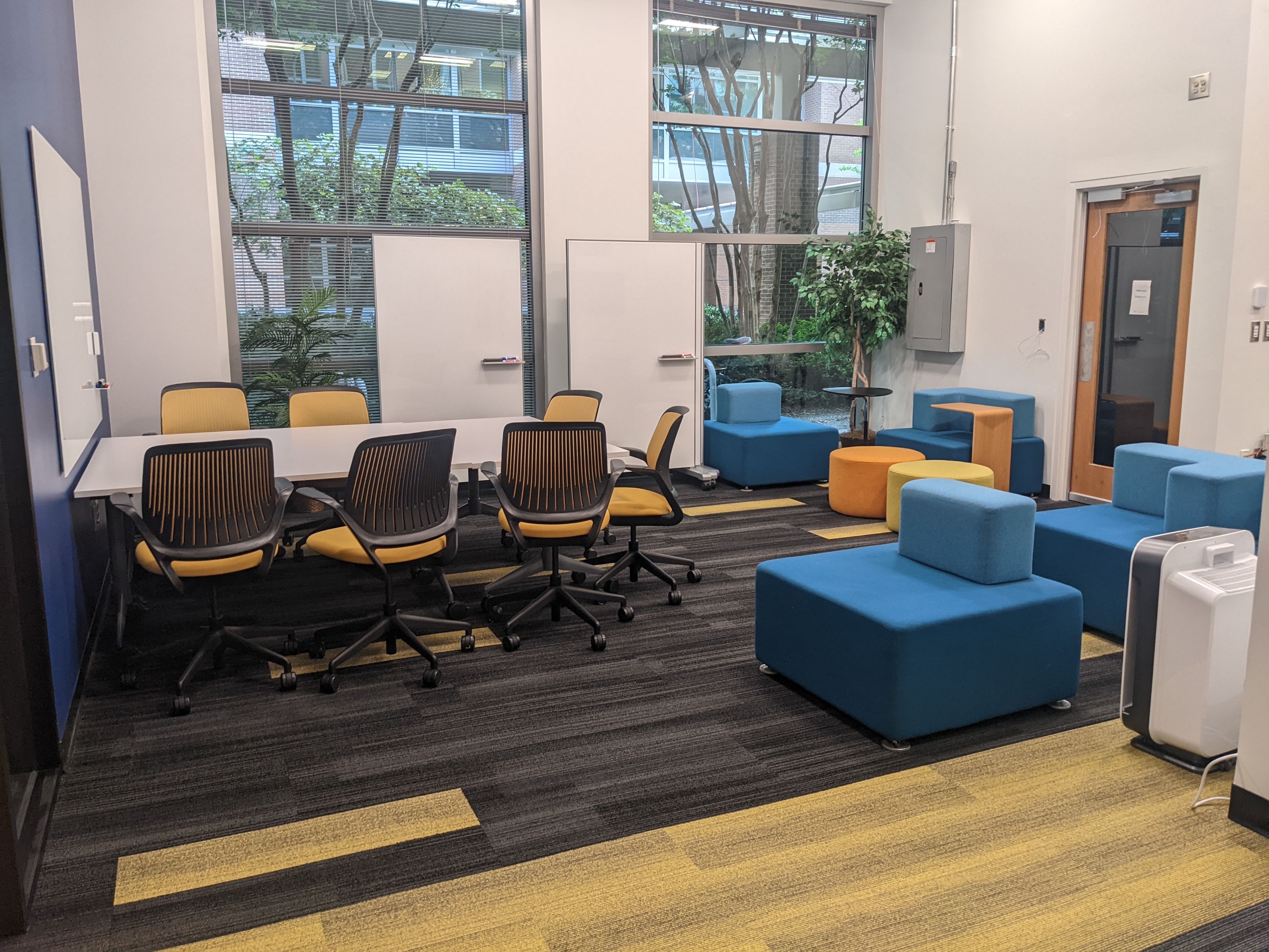 View of entire room including tables and comfortable chairs