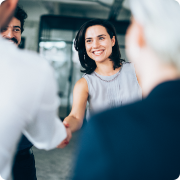 colleagues interacting and shaking hands