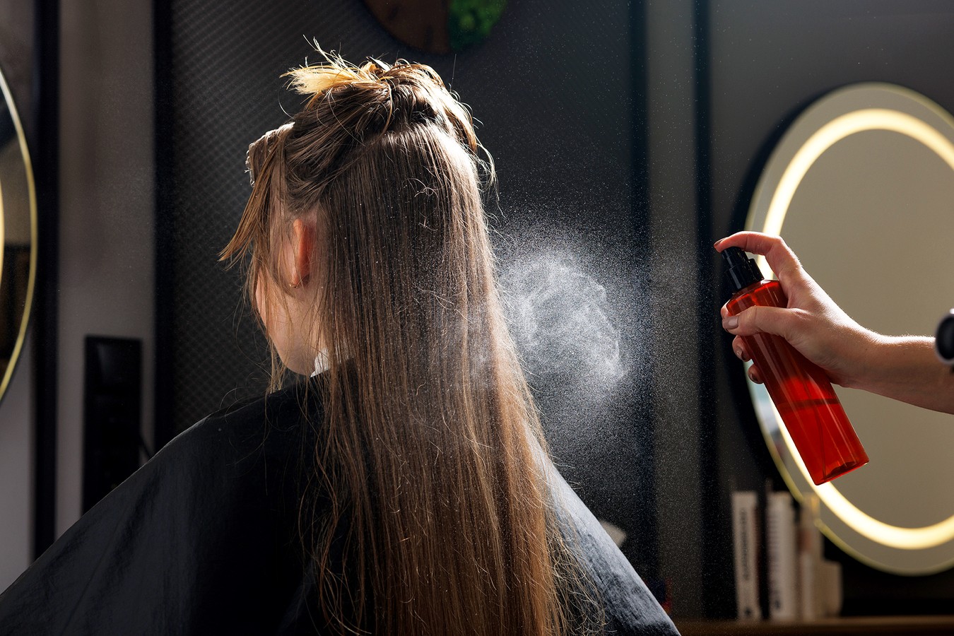 Hair Spray used on hair in a salon - Credit: Sergii Kolesnikov/Getty Images