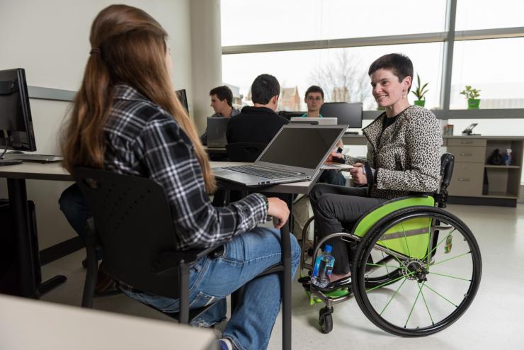 <p>Informaticist and biomedical engineer Cassie Mitchell studies Alzheimer's Disease by statistically analyzing data produced by dozens of peer-reviewed published Alzheimer's studies. She looks for correlations between the presence of biochemical factors and cognitive decline. Credit: Georgia Tech / Rob Felt</p>