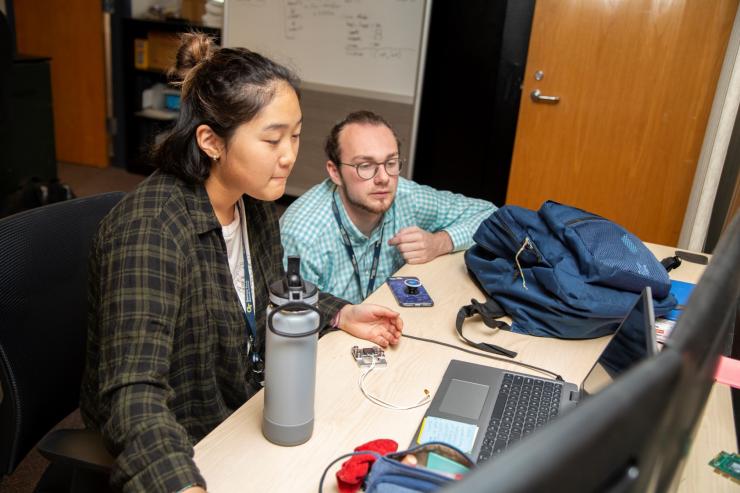 <p>GTRI Research Engineer William Stuckey (right), who served as a program mentor for GTRI's high school summer internship, works with an intern on a project (Credit: Christopher Moore, GTRI). </p>