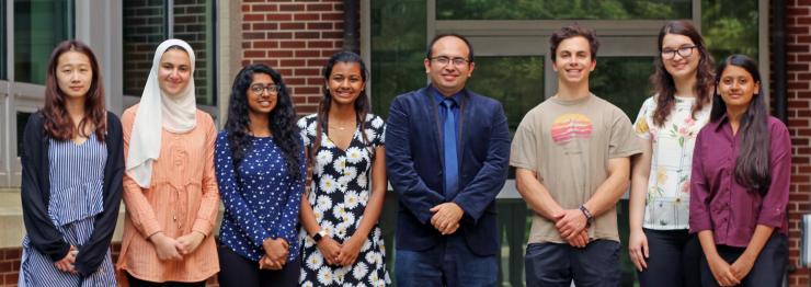 Ahmet Coskun (fourth from right) is flanked by members of the BioE Media Lab. Lead author of the paper on digital posters, Mythreye Venkatesan, is at far right.