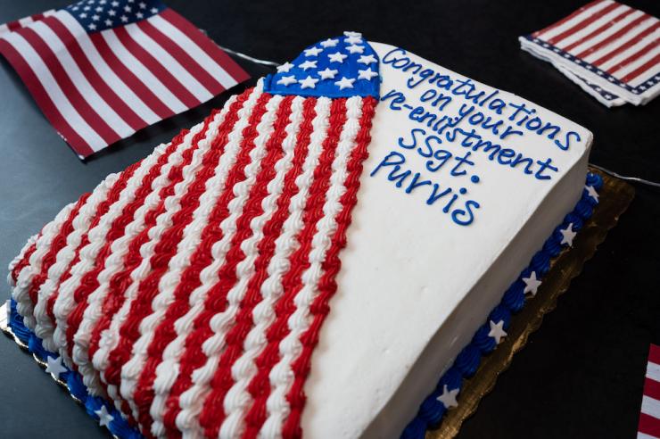 Army Staff Sgt. Trisha Purvis' colleagues at the Global Center for Medical Innovation, celebrate her reenlistment with a celebratory cake. (Photo: Joya Chapman)