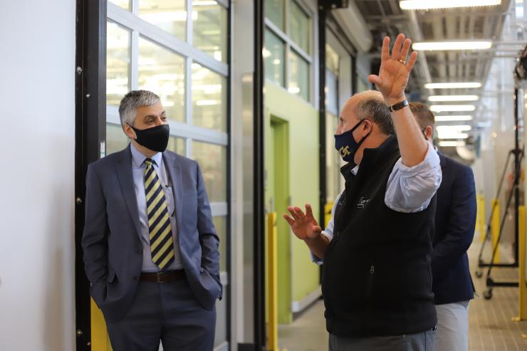 <p>Chaouki Abdallah, executive vice president for Research, and Paul M. Dabbar, undersecretary for science at the U.S. Department of Energy, engage in discussion during a tour of the Carbon Neutral Energy Solutions Laboratory on Sept. 25, 2020. Photo by Ashley Ritchie</p>