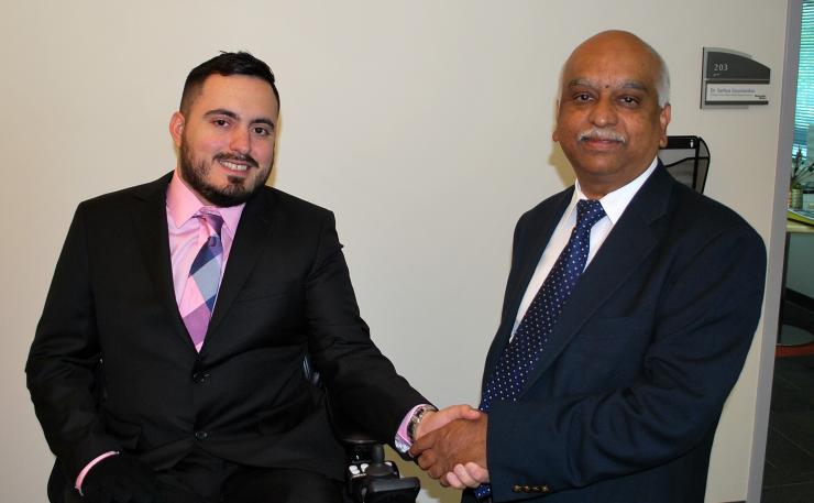 <p>Sathya Gourisankar (right), director of the MBID program, congratulates its 100th graduate, Ignacio Montoya.</p>