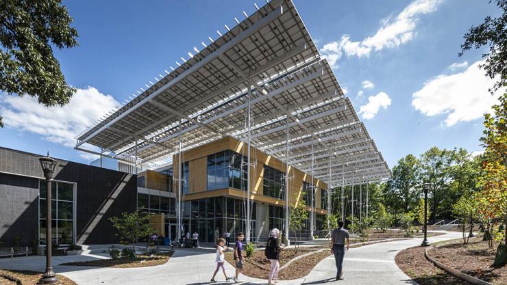 <p>The Kendeda Building for Innovative Sustainable Design features a large "front porch" shaded by some of the hundreds of solar panels that generate electricity for the building. (Photo: Justin Chan Photography)</p>