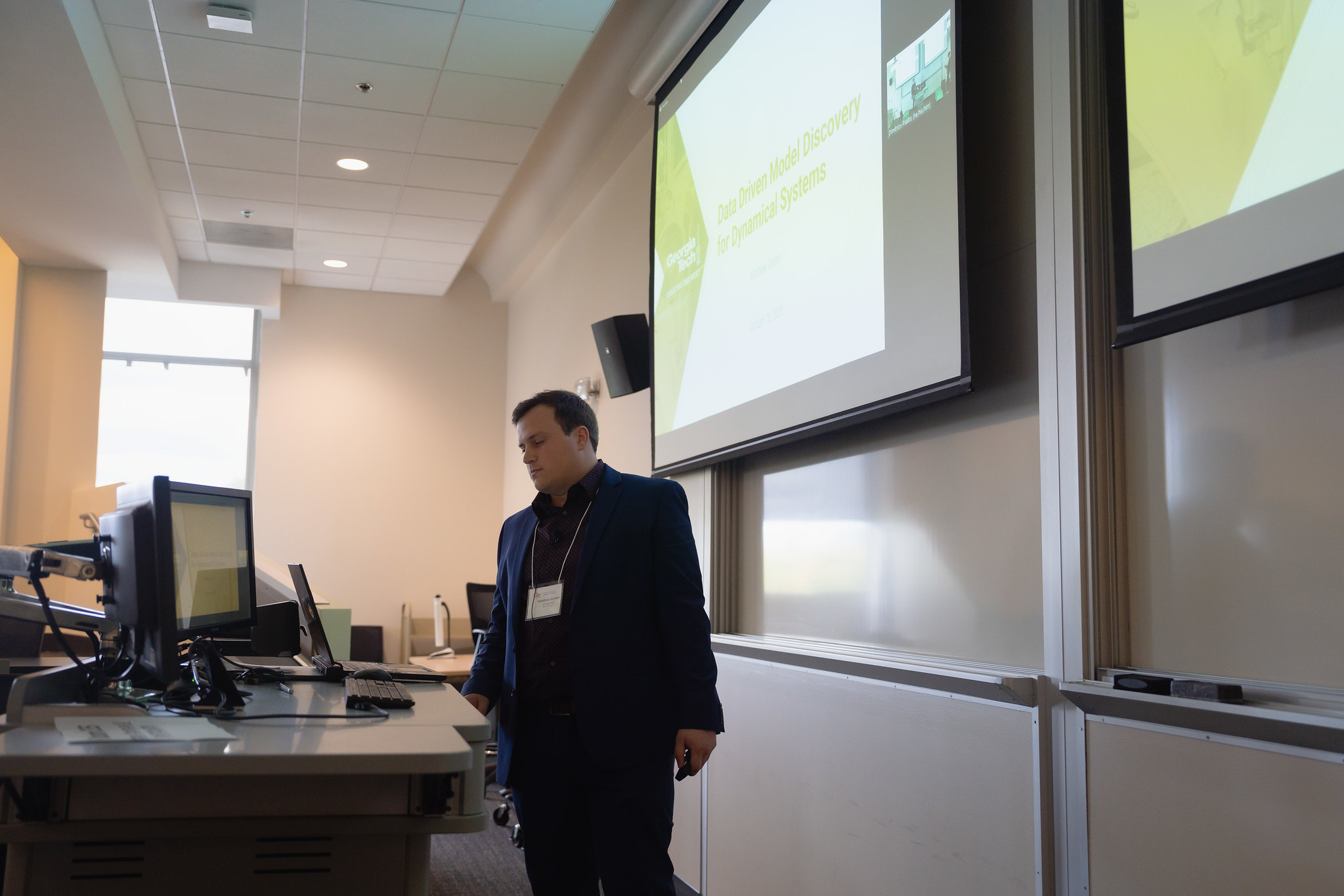 Matthew Golden, graduate student researcher in the School of Physics, presents at a recent machine learning conference at Georgia Tech. (Photo Benjamin Zhao)