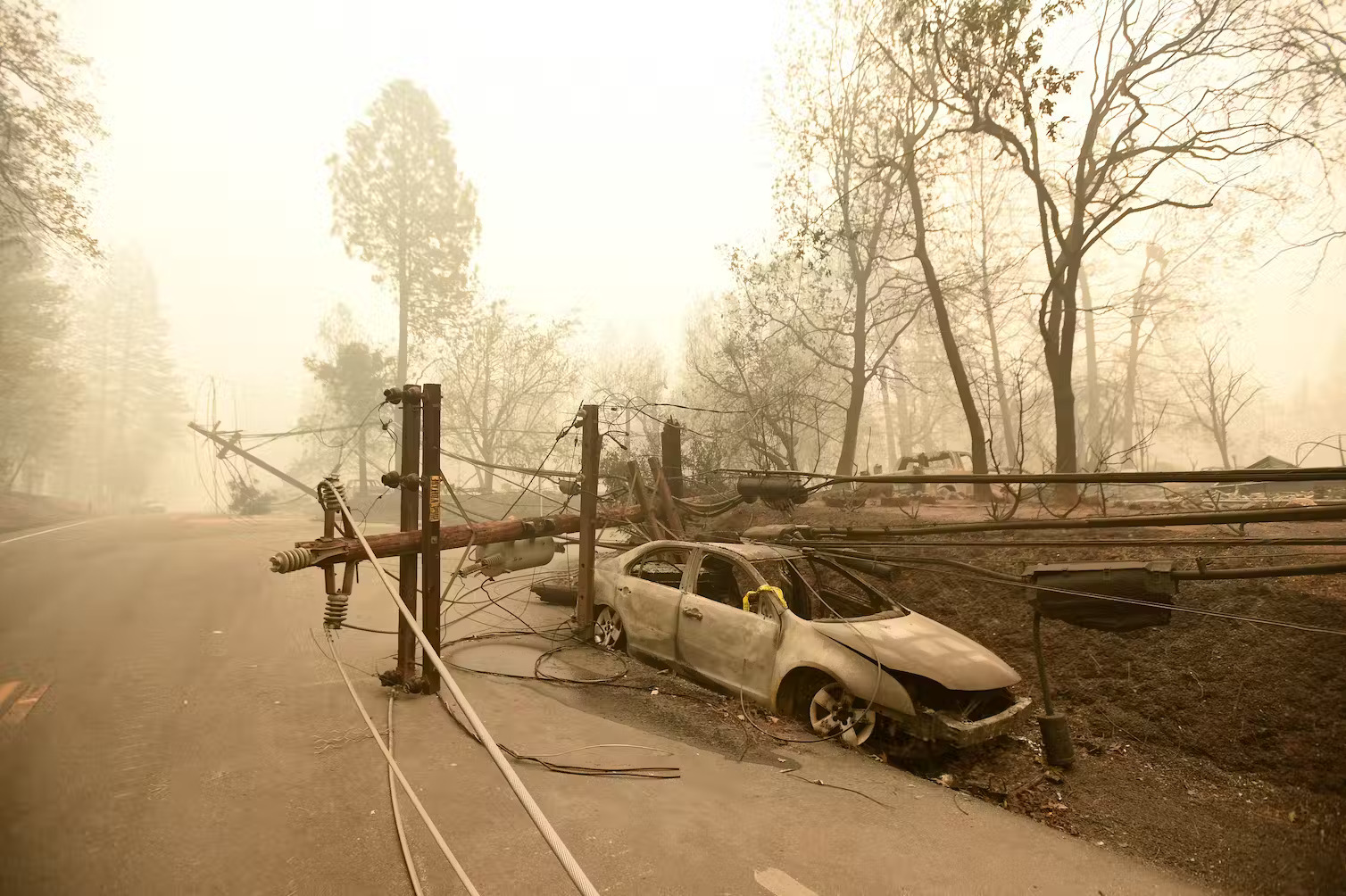 The utility Pacific Gas & Electric acknowledged responsibility for equipment that started the deadly 2018 blaze that burned through Paradise, Calif. Josh Edelson/AFP via Getty Images