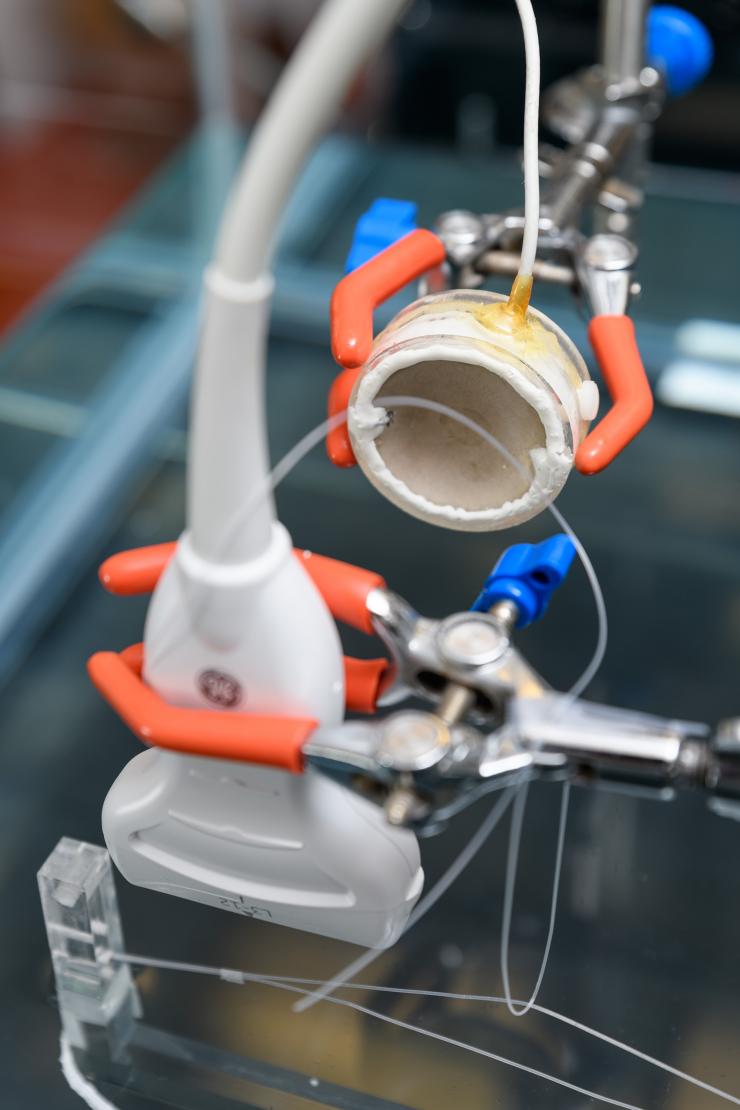 <p>The parabolic shape helps researchers focus ultrasound energies to concentrate them on an area. This is a set-up in Costas Arvanitis's Georgia Tech lab to test the device and is not part of a treatment or experiment. Credit: Georgia Tech / Rob Felt</p>