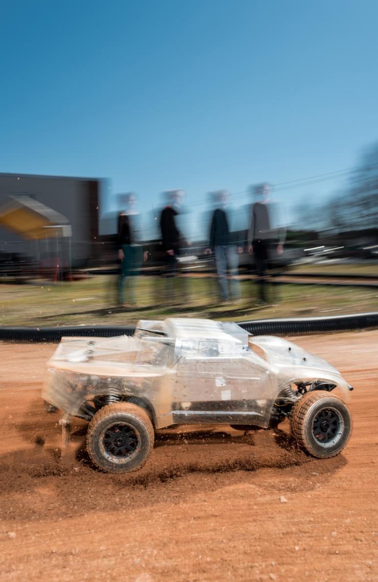 <p>At the Georgia Tech Autonomous Racing Facility, researchers are studying a one-fifth-scale autonomous vehicle as it traverses a dirt track. The work will help the engineers understand how to help driverless vehicles face the risky and unusual road conditions of the real world. (Credit: Rob Felt, Georgia Tech)</p>