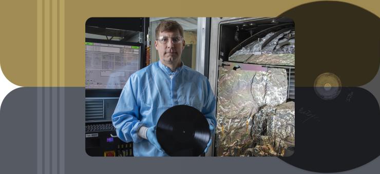 GTRI researchers used this equipment to apply wear-resistant coatings. Shown is Jud Ready holding an acetate of the type used in the research. Credit: Christopher Moore