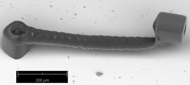 <p>Overhanging 3D structures printed by stitching multiple 2D projections, demonstrating the ability to print depth-resolved features. The bridge structure, with 90-degree overhangs, is challenging to print using serial scanning TPL techniques. (Credit: Vu Nguyen and Sourabh Saha)</p>