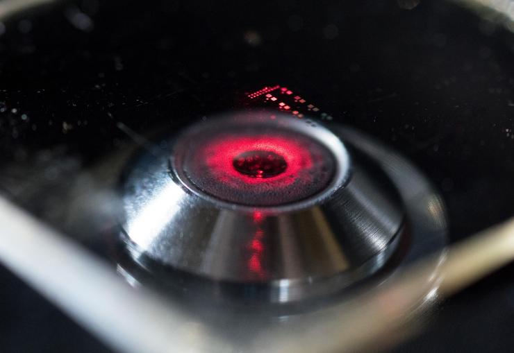 <p>Laser light shows the nanopatterned structure of a chiral metamaterial developed by researchers in the School of Electrical and Computer Engineering at the Georgia Institute of Technology. (Credit: Rob Felt, Georgia Tech)</p>