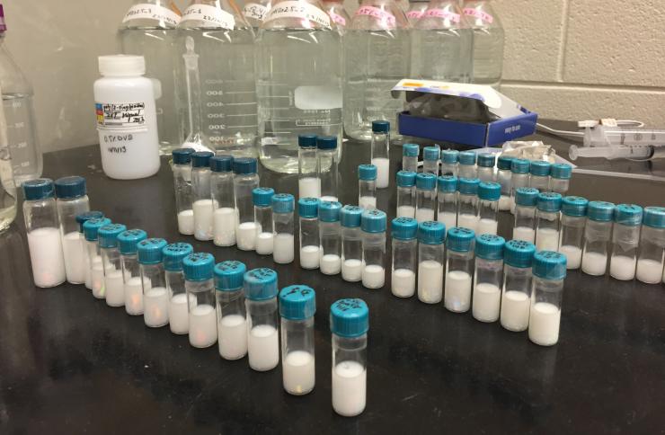 <p>Vials containing microgel particles await analysis in the laboratory of Alberto Fernandez-Nieves at Georgia Tech. Researchers now believe they understand why oversized microgel particles spontaneously shrink to allow formation of colloidal crystals in assemblies of smaller microparticles. (Credit: John Toon, Georgia Tech)</p>