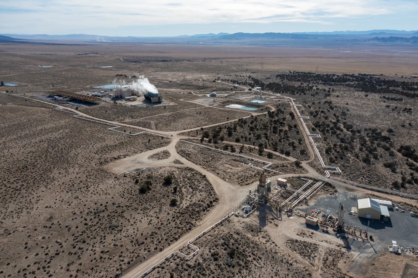 A geothermal production well and the Blundell Geothermal Power Plant near Milford, Utah. This well provides 400 degree steam and hot water from deep underground to run the turbines at the power plant. Credit: Jon G. Fuller/VW Pics/ Universal Images Group via etty Images