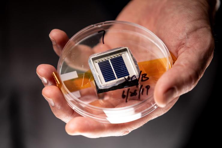 <p>A silicon solar cell fabricated in the University Center of Excellence in Photovoltaic Research and Education. (Photo: Branden Camp, Georgia Tech)</p>