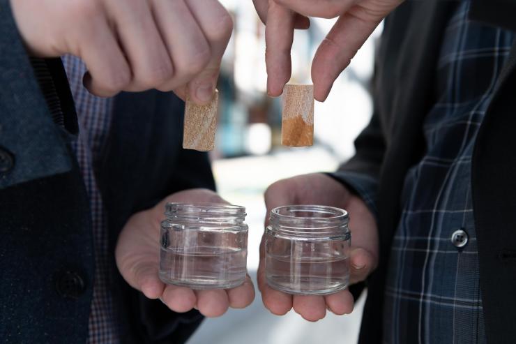 <p>Two pieces of lumber shown after being submerged in water. On the left side is lumber that has been treated using atomic layer deposition and resisted absorbing water. On the right side is untreated lumber that readily absorbs water shown for comparison. (Credit: Allison Carter, Georgia Tech)</p>