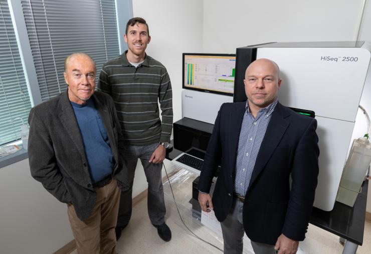 <p>Georgia Tech researchers (l-r) John McDonald, Evan Clayton and Fredrik Vannberg are shown with sequencing equipment in Georgia Tech’s Petit Institute for Bioengineering and Bioscience. (Credit: Rob Felt, Georgia Tech)</p>