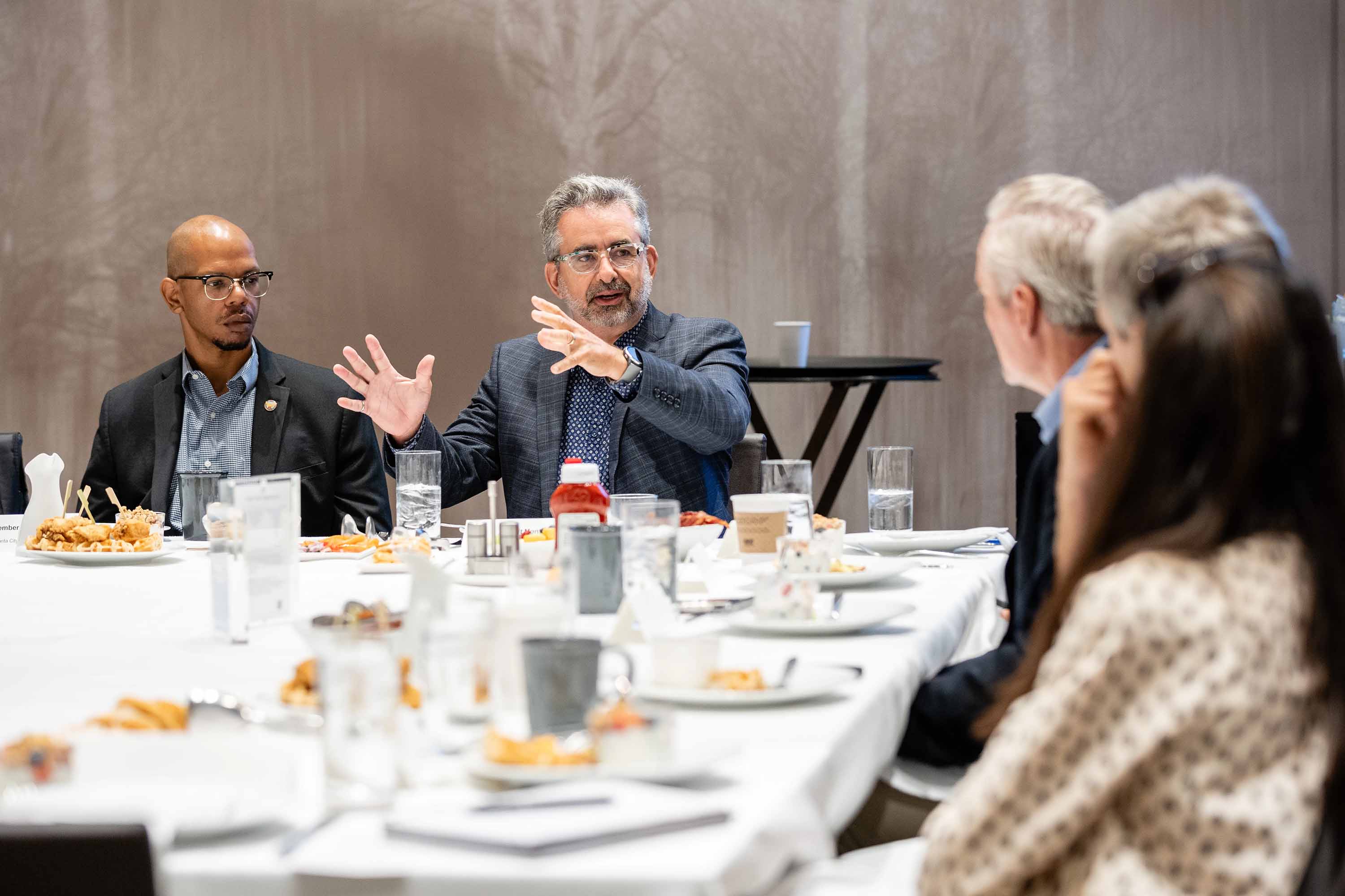 Benoit Montreuil speaking to the Axios roundtable group. Credit: Shay Richards for Axios