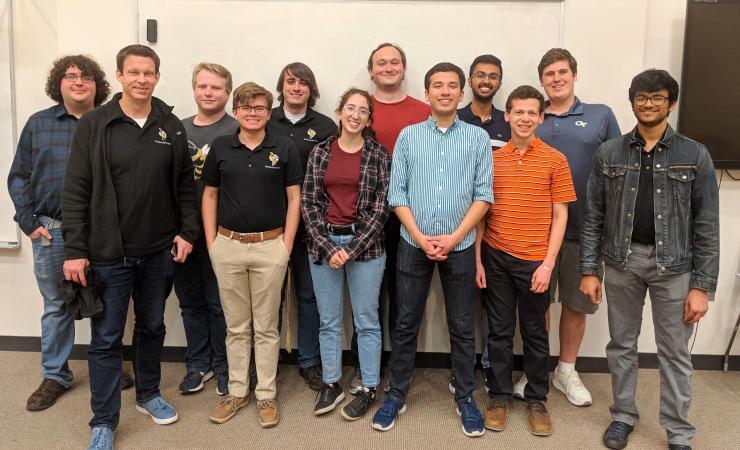 <p>RoboJackets Founder Brad Geving meets with current members during the RoboJackets 20th-anniversary celebration held March 30.</p>