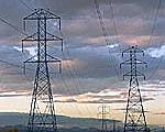 Power lines against a colorful dusk sky.