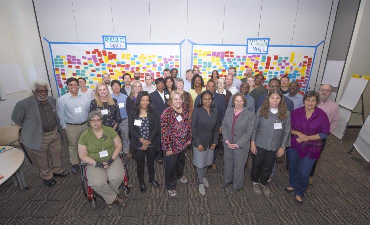 <p>Participants of the Negotiating the Digital and Data Divide Workshop, in front of the wall of challenges and visions on the future of data science education.</p>