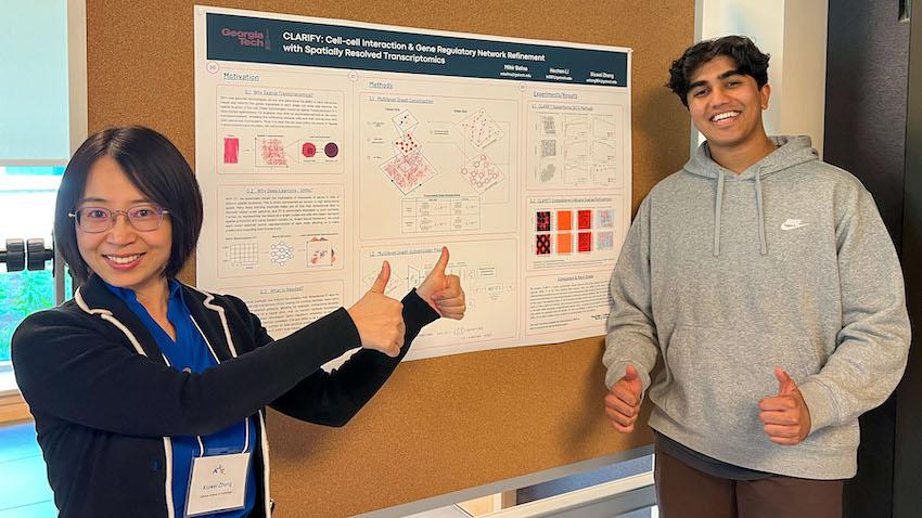 Mihir Bafna, a fourth-year CS major at Georgia Tech smiles for a photo with his mentor School of CSE Assistant Professor Xiuwei Zhang in front of their award-winning poster describing their latest research. (Photos by courtesy asset)