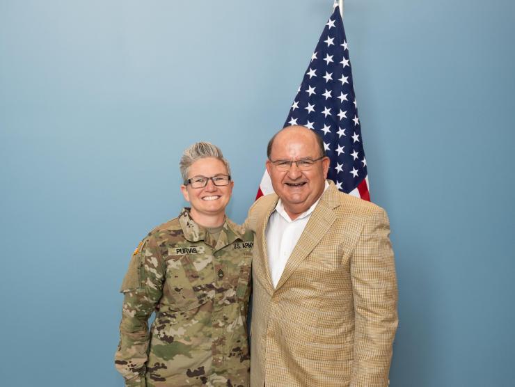 Trisha Purvis (left), a veterinary surgical technician at the Global Center for Medical Innovation, recently re-enlisted in the United States Army Reserve. Ken Zielmanski, director of quality assurance for GCMI’s T3 Labs and a retired Army lieutenant colonel, performed the re-enlistment ceremony. (Photo: Joya Chapman)