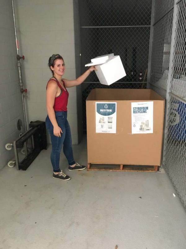 Graduate student Hannah Viola using the Gaylord collection box in Krone EBB