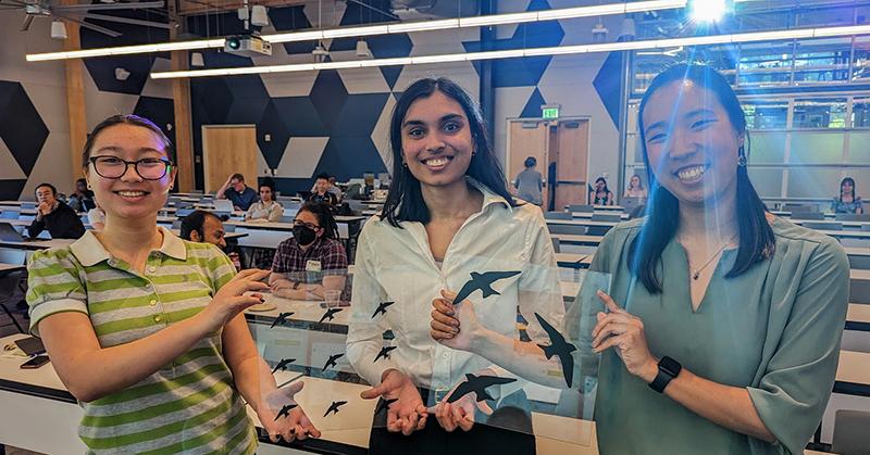 The Bird Safe Campus team shows their prototype window decals. L to R. - Amanda Janusz, Shivani Potdar, and Kaitlyn Tran.