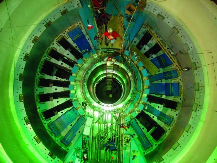 <p>A massive part of Oak Ridge National Laboratory's Spallation Neutron Source during its construction phase in earlier years. The hole in the center is where the target crystal for neutron scattering is placed. Credit: Oak Ridge National Laboratory</p>