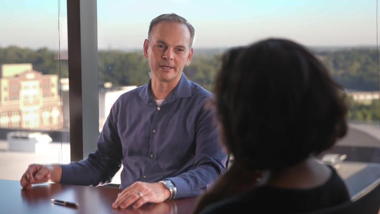 <p>Rob “Radar” Winston, the GTRI principal research engineer who directs the IMPAX program, discusses how the initiative will serve the Naval Air Warfare Center - Aircraft Division. (Credit: Branden Camp, Georgia Tech) </p>