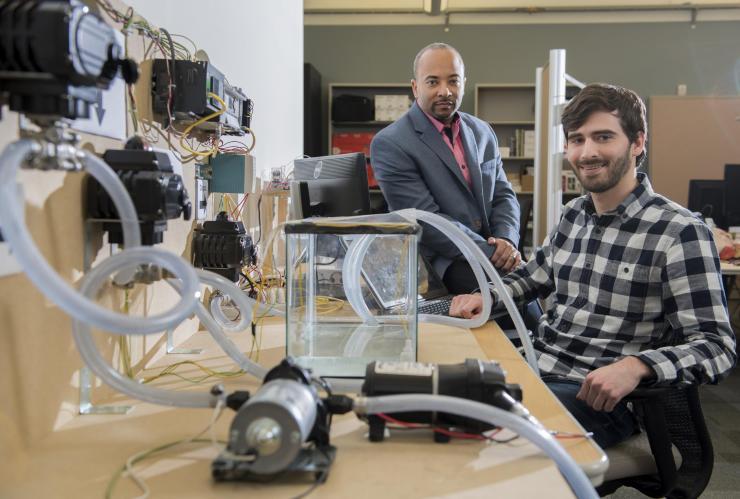 <p>Georgia Tech researchers have developed a new form of ransomware that can take over control of a simulated water treatment plant. The simulated attack was designed to highlight vulnerabilities in the control systems used to operate industrial facilities. Shown are (left) Raheem Beyah, associate chair in the Georgia Tech School of Electrical and Computer Engineering, and David Formby, a Georgia Tech Ph.D. student. (Credit: Christopher Moore, Georgia Tech) </p>