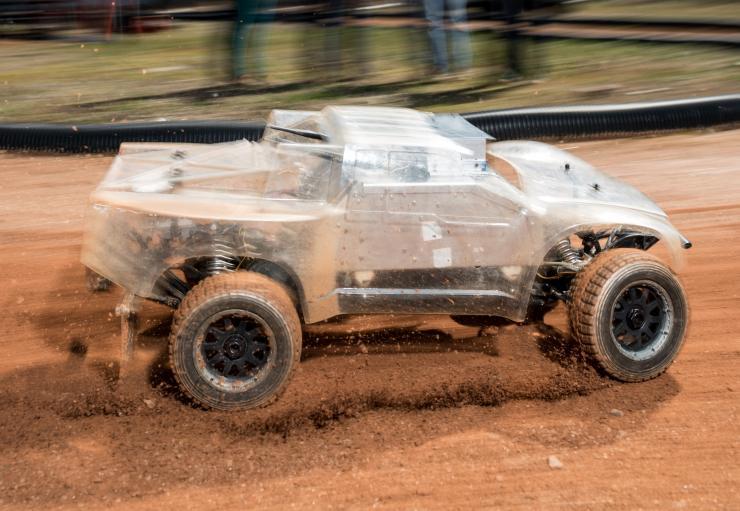 <p>At the Georgia Tech Autonomous Racing Facility, researchers are studying a one-fifth-scale autonomous vehicle as it traverses a dirt track. The work will help the engineers understand how to help driverless vehicles face the risky and unusual road conditions of the real world. (Credit: Rob Felt, Georgia Tech)</p>