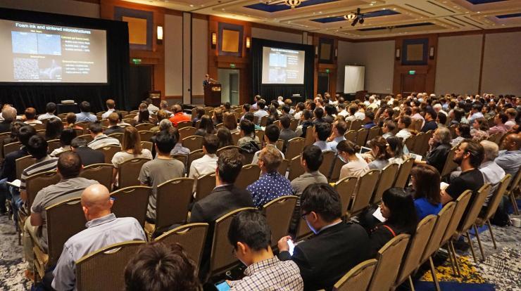 <p>A crowded room greets the first speaker of the day at the 93rd ACS Colloid &amp; Surface Science Symposium at Georgia Tech.</p>