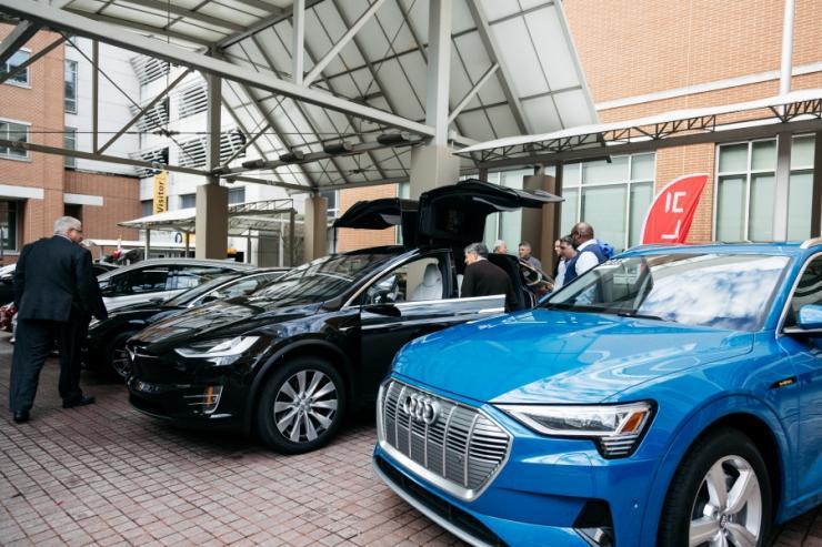 <p>Image of electric vehicles parked outside GT Hotel for Policy Forum</p>