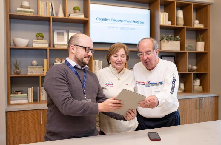 <p>Cognitive Empowerment Program participants Lyn Reagan and Steve Baltz with (left) CEP researcher Matt Doiron. (Credit: Rob Felt, Georgia Tech)</p>