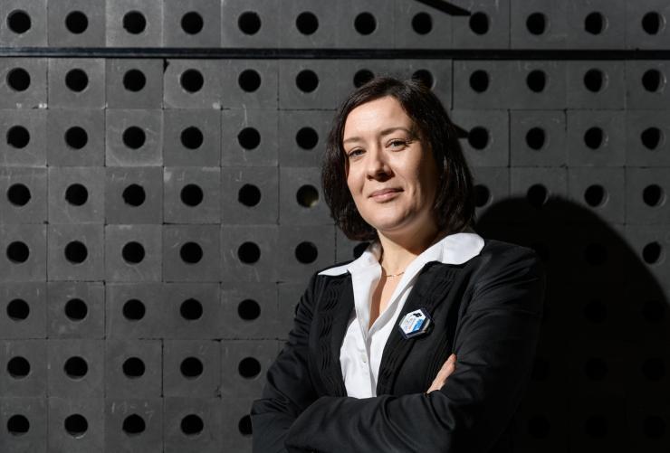 <p>Associate Professor Anna Erickson shown with the subcritical graphite pile used to teach radiation physics concepts at Georgia Tech. (Photo: Rob Felt, Georgia Tech)</p>