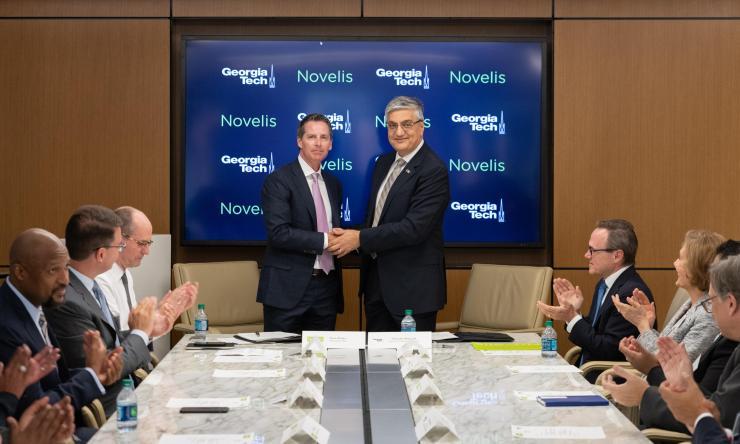 <p>Novelis President and CEO Steve Fisher and Georgia Tech Executive Vice President for Research Chaouki Abdallah. (Photo: Rob Felt, Georgia Tech)</p>