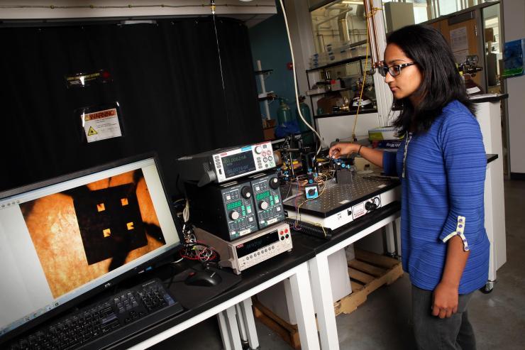 <p>Akanksha Menon, a Ph.D. student in the Woodruff School of Mechanical Engineering at the Georgia Institute of Technology, measures electrical conductivity of a thermoelectric polymer film device. (Credit: Candler Hobbs, Georgia Tech).</p>