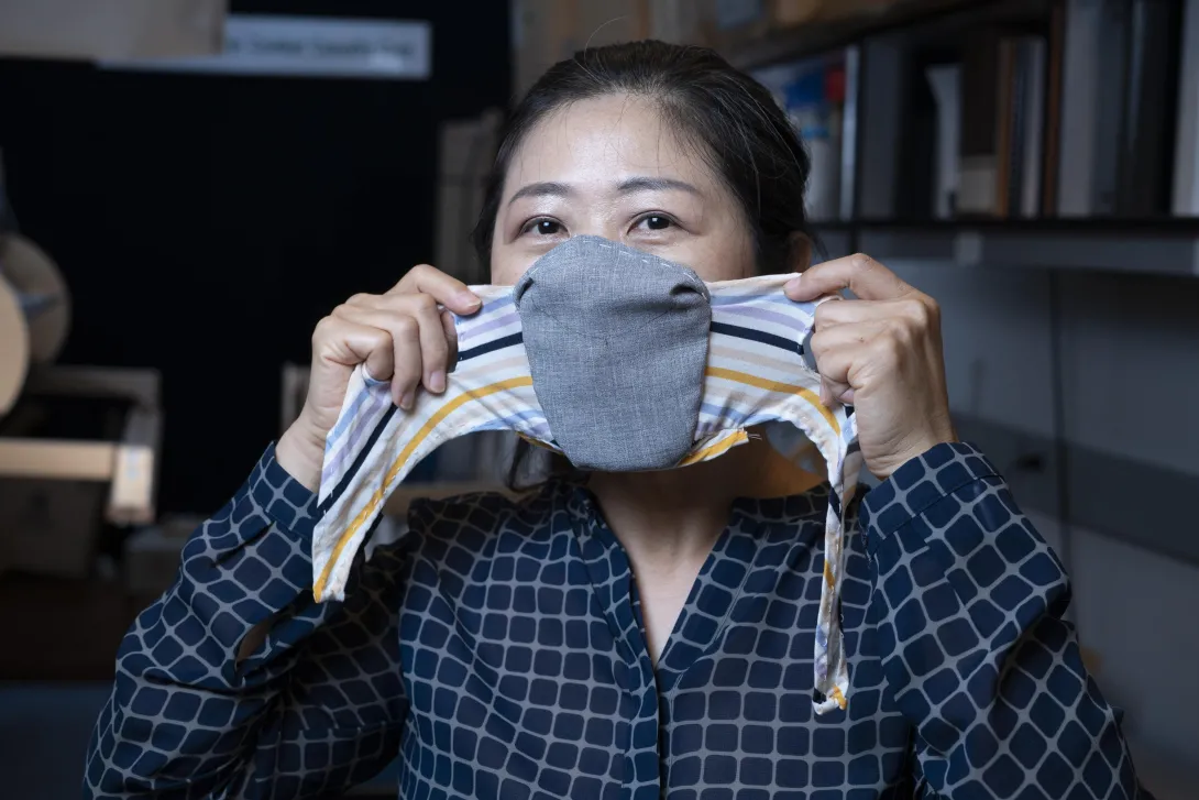 Researcher putting mask on
